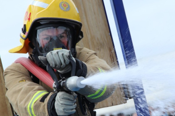 A firefighter with a hose