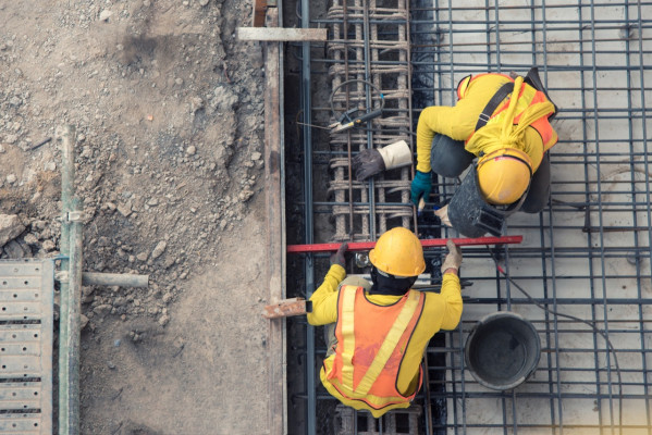 Aerial view of two builders at work